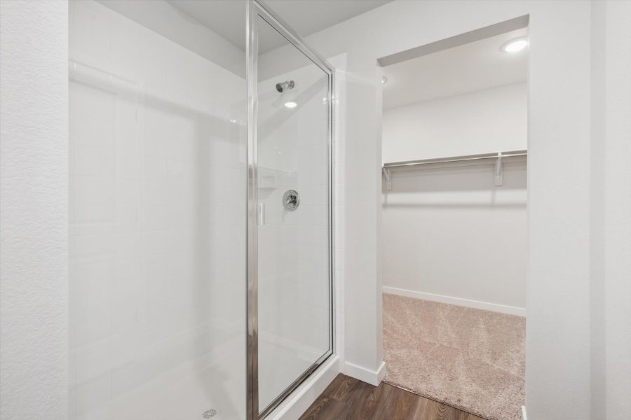 A shower with a glass door. A shower with a glass door.
