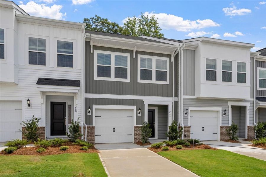 Front exterior of a new home in West Main Townhomes, Sanford, NC, highlighting curb appeal (Image 18).