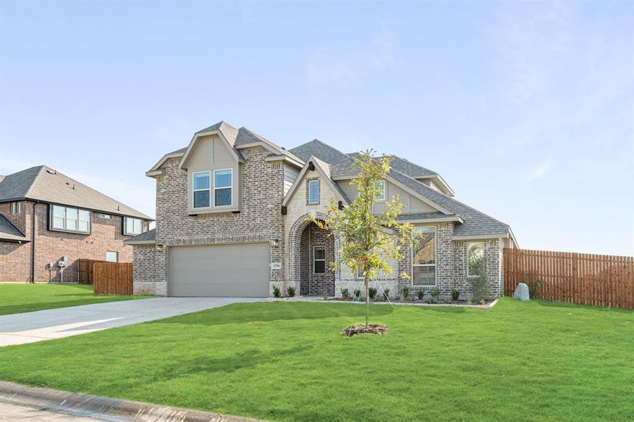 Front exterior of a new home in Coyote Crossing, Godley, TX, highlighting curb appeal (Image 26).