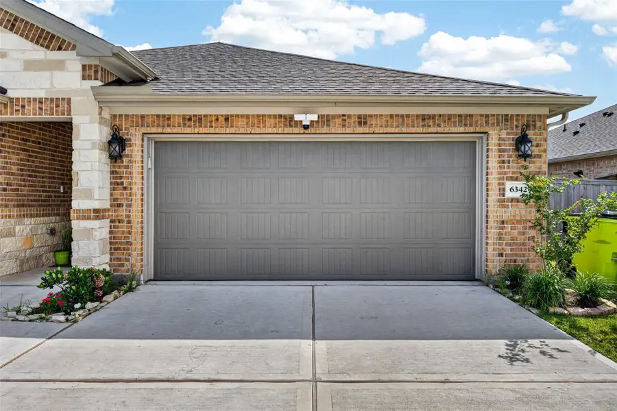 Exterior details and patio area of a home in Wall Street Village, Richmond (Image 3).