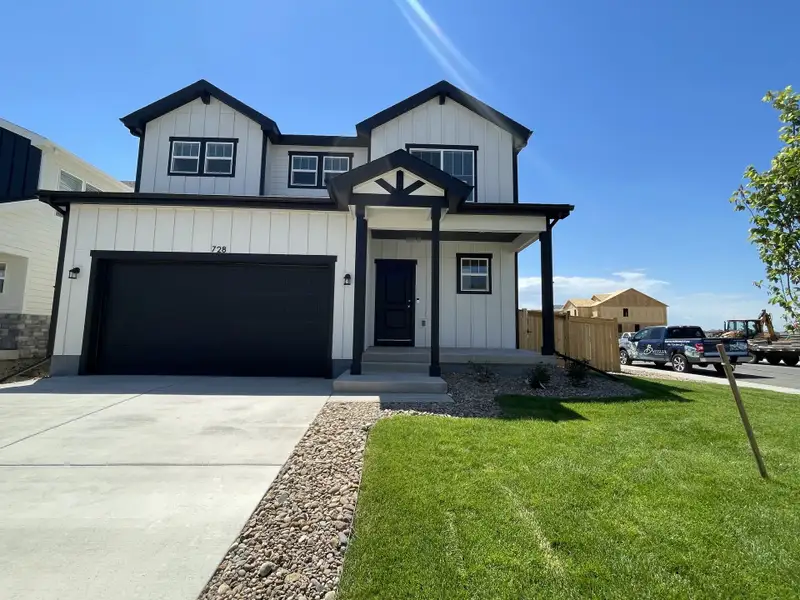 Front exterior of a new home in Granary, Johnstown, CO, highlighting curb appeal (Image 2). Front exterior of a new home in Granary, Johnstown, CO, highlighting curb appeal (Image 2).
