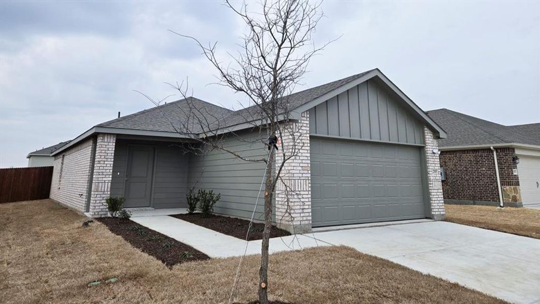 Front exterior of a new home in Leonard Crossing, Leonard, TX, highlighting curb appeal (Image 1). Front exterior of a new home in Leonard Crossing, Leonard, TX, highlighting curb appeal (Image 1).