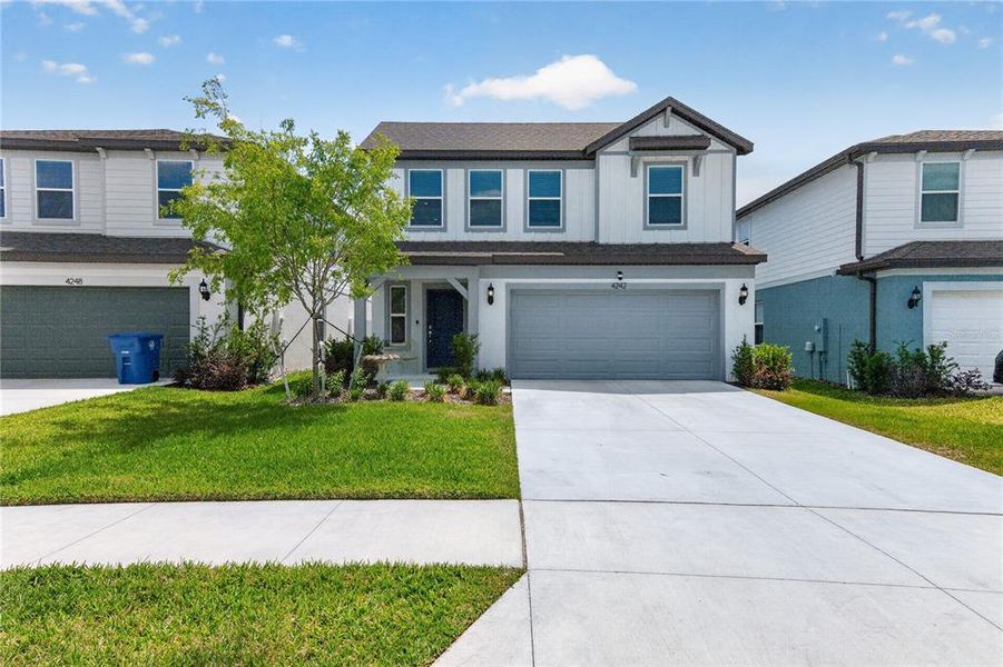 Front exterior of a new home in Caldera, Spring Hill, FL, highlighting curb appeal (Image 28).