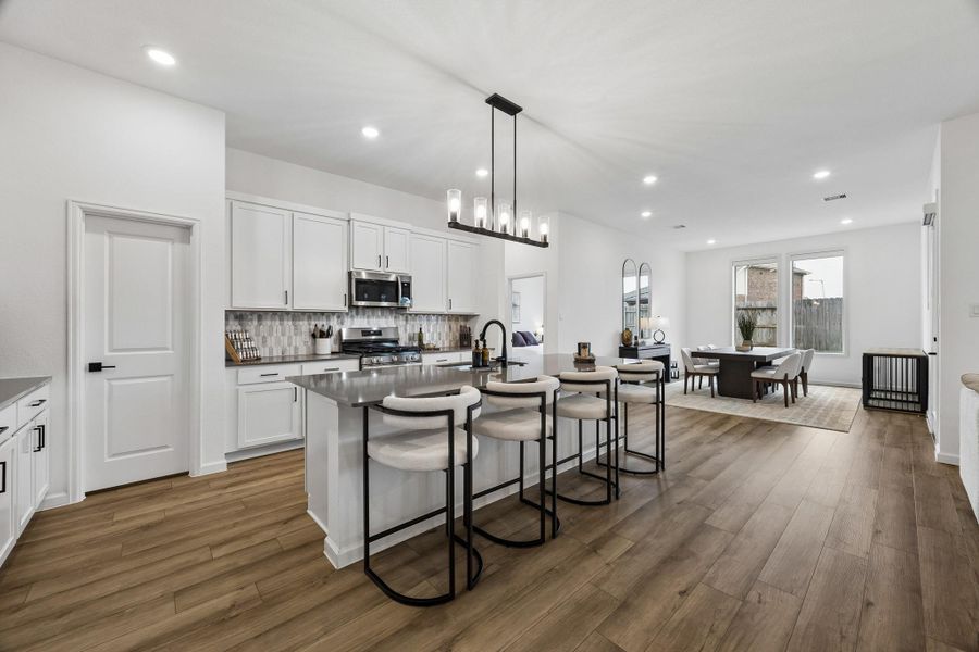 View of the kitchen and formal dining room. View of the kitchen and formal dining room.