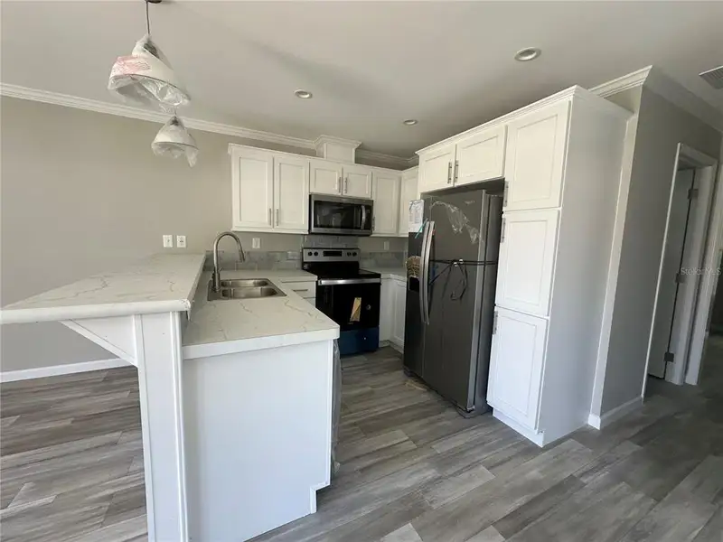 Furnished interior view inside a new home in , Astor (Image 4).