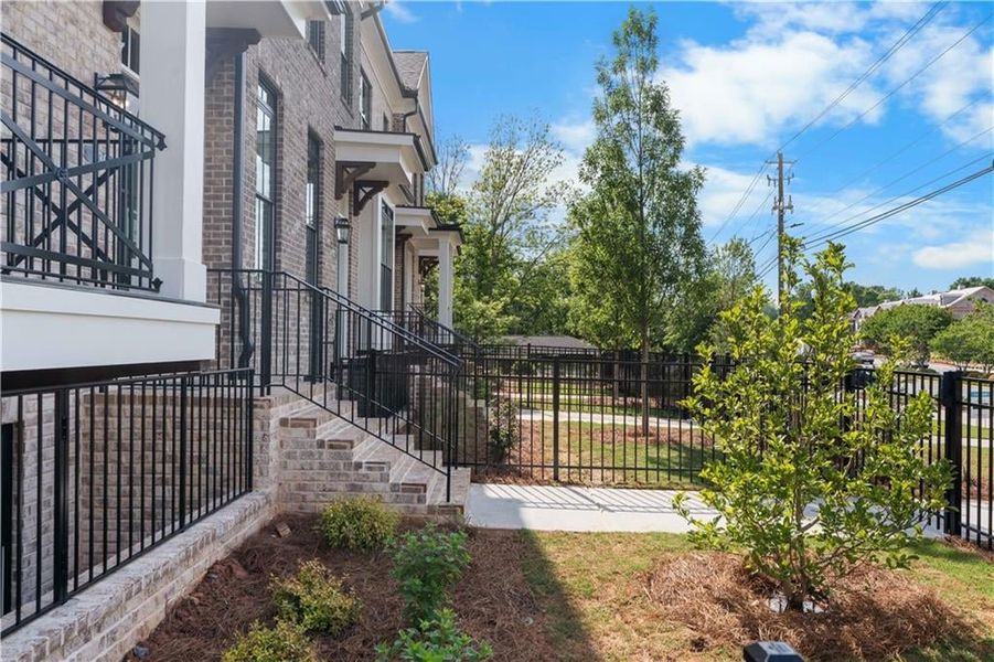 Beautifully landscaped front fenced yard