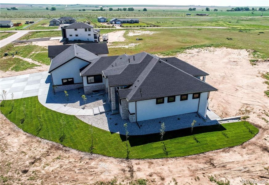 Front exterior of a new home in , Strasburg, CO, highlighting curb appeal (Image 2).