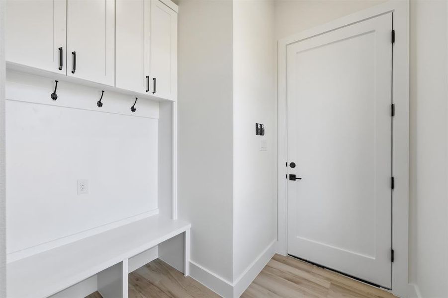 Mud room by garage entry. Mud room by garage entry.
