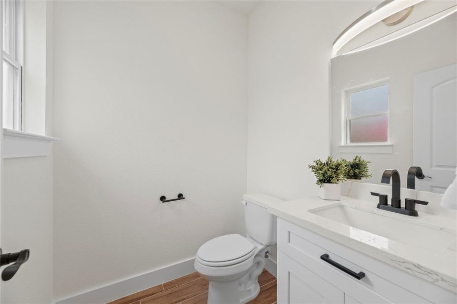 Hospitality is felt throughout the home and the powder room is no exception. Hospitality is felt throughout the home and the powder room is no exception.