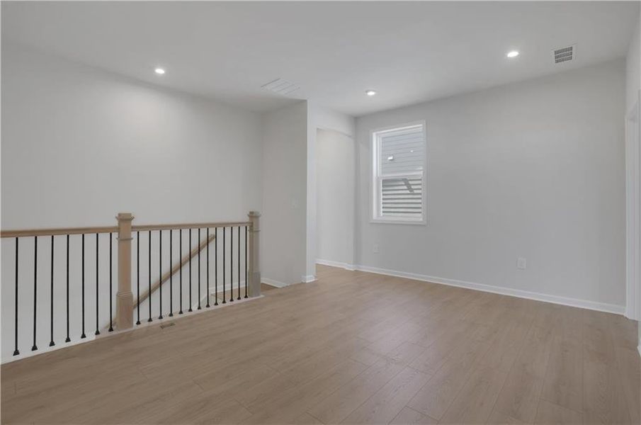 Spacious, unfurnished interior of a new home in The Paddocks at Doc Hughes, Buford (Image 38).