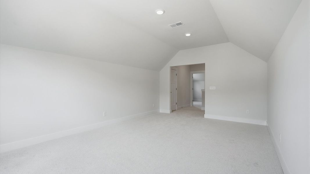 Top-notch design defines this upstairs bonus room with carpeted floors and an open, airy layout Top-notch design defines this upstairs bonus room with carpeted floors and an open, airy layout