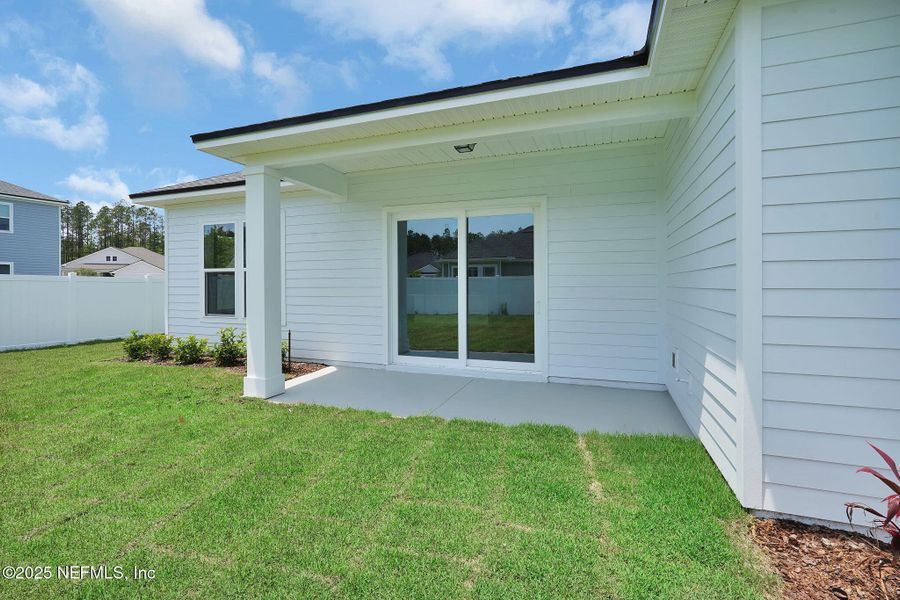 Exterior details and patio area of a home in Forest Park at Wildlight, Yulee (Image 24).