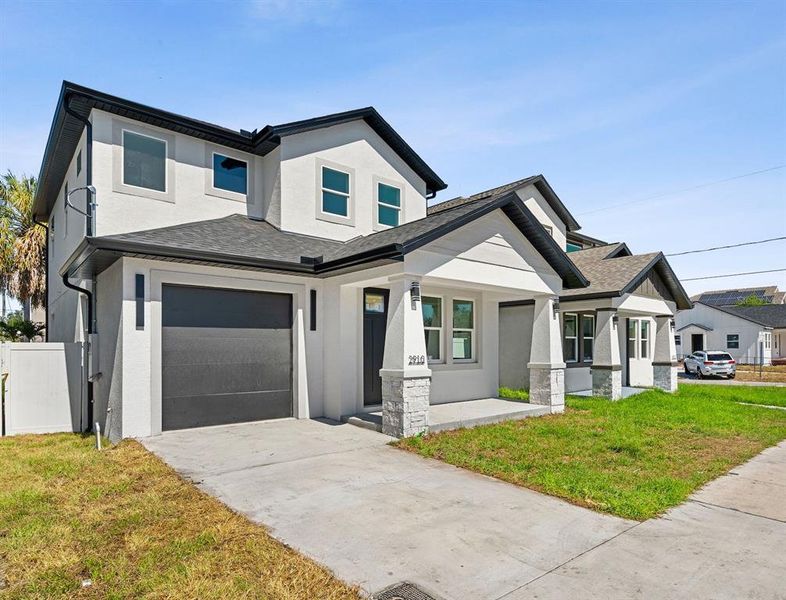 Front exterior of a new home in , Tampa, FL, highlighting curb appeal (Image 21). Front exterior of a new home in , Tampa, FL, highlighting curb appeal (Image 21).