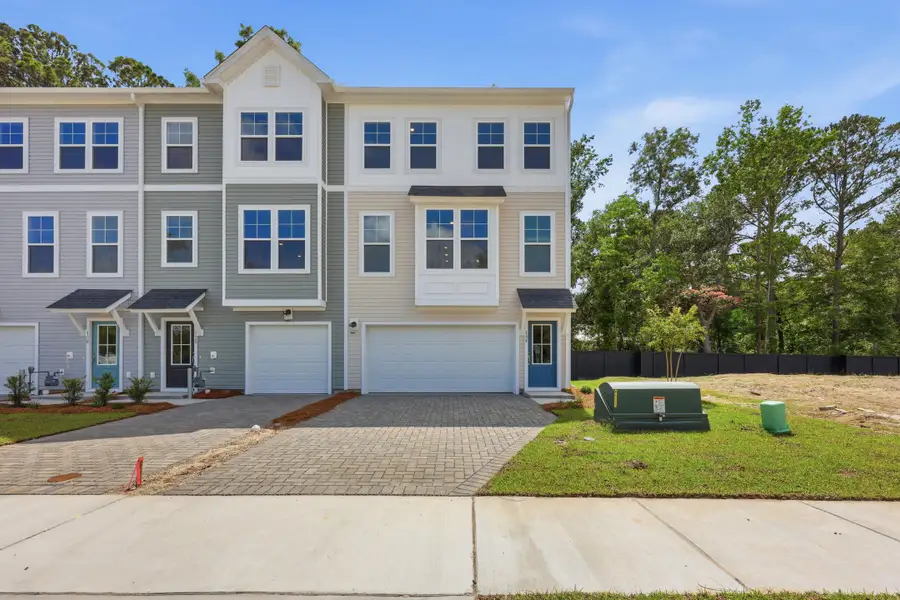 Front exterior of a new home in Rhetts Cove, Johns Island, SC, highlighting curb appeal (Image 2). Front exterior of a new home in Rhetts Cove, Johns Island, SC, highlighting curb appeal (Image 2).