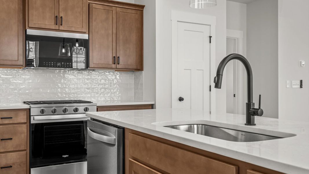 Accomplished layout with a first-class kitchen in this select townhome community by DRB Homes