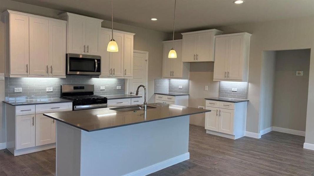 Kitchen - All Home and community information, including pricing, included features, terms, availability and amenities, are subject to change at any time without notice or obligation. All Drawings, pictures, photographs, video, square footages, floor plans, elevations, features, colors and sizes are approximate for illustration purposes only and will vary from the homes as built.