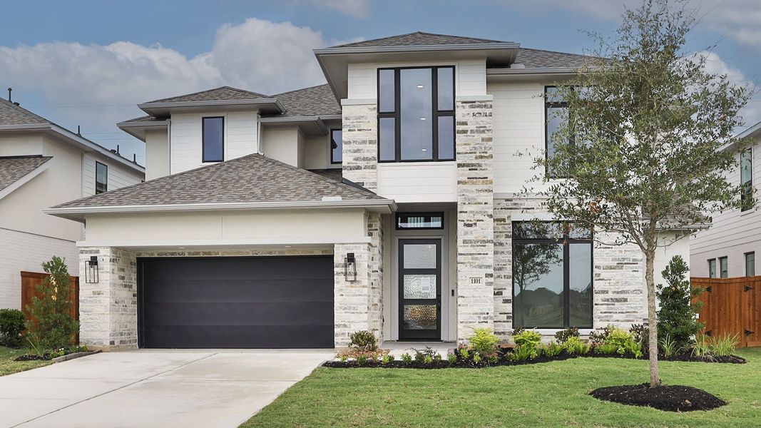 Front exterior of a new home in Lakes of Cane Island, Katy, TX, highlighting curb appeal (Image 1). Front exterior of a new home in Lakes of Cane Island, Katy, TX, highlighting curb appeal (Image 1).
