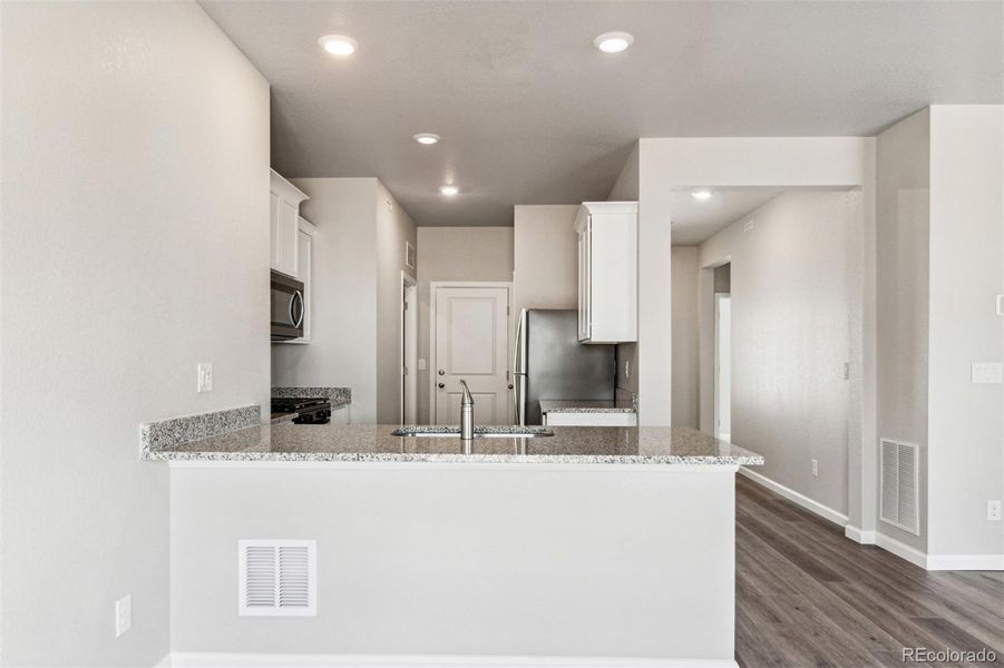 Furnished interior view inside a new home in Second Creek Farm, Commerce City (Image 5).