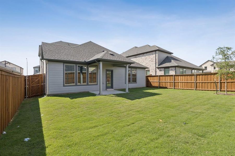 Covered Patio in the Stanley II home plan by Trophy Signature Homes – REPRESENTATIVE PHOTO