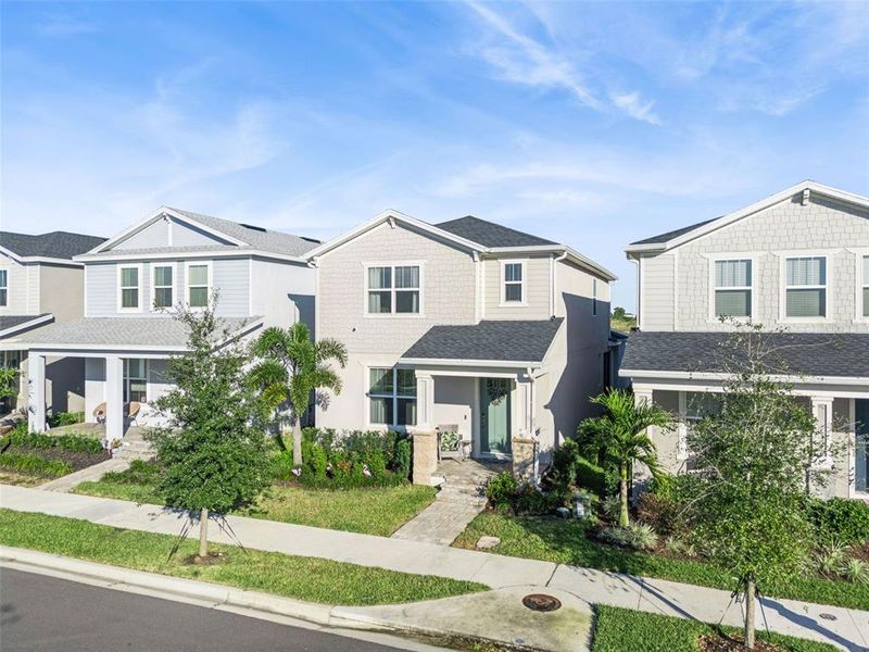 Front exterior of a new home in , Winter Garden, FL, highlighting curb appeal (Image 32).