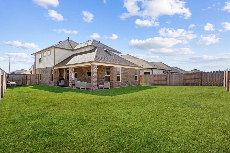 Exterior details and patio area of a home in Sunterra, Katy (Image 3).