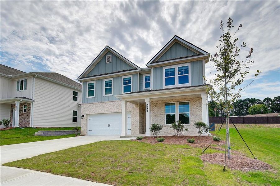 Front exterior of a new home in Abbotts Crossing, Conyers, GA, highlighting curb appeal (Image 1). Front exterior of a new home in Abbotts Crossing, Conyers, GA, highlighting curb appeal (Image 1).