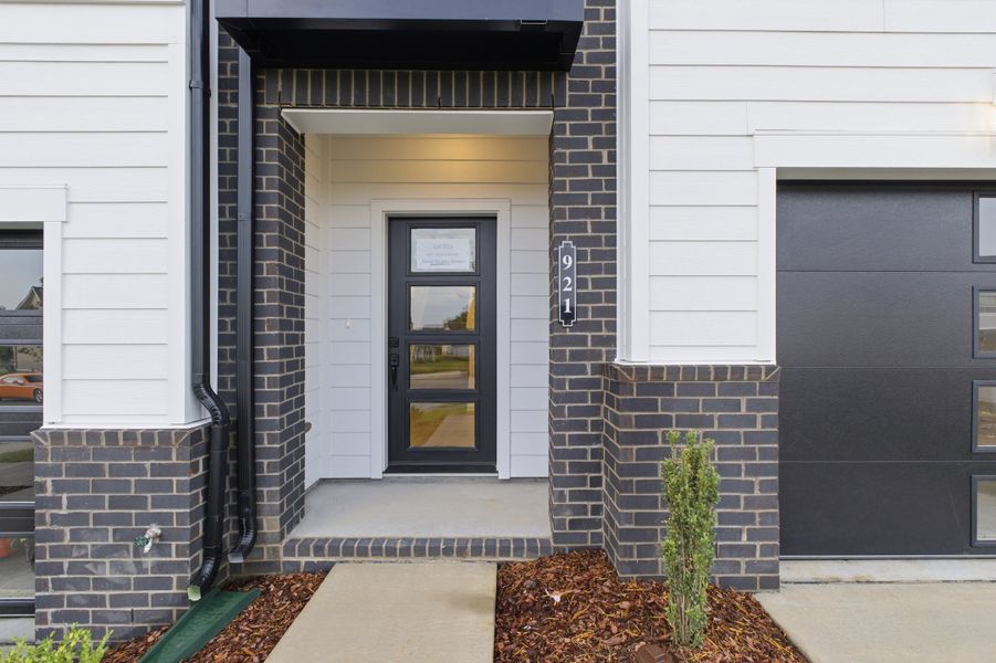 Exterior details and patio area of a home in Nexus Townhomes, Gallatin (Image 24).