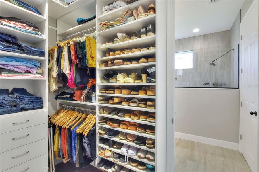 Custom walk-in closet, located off of Primary Bath.