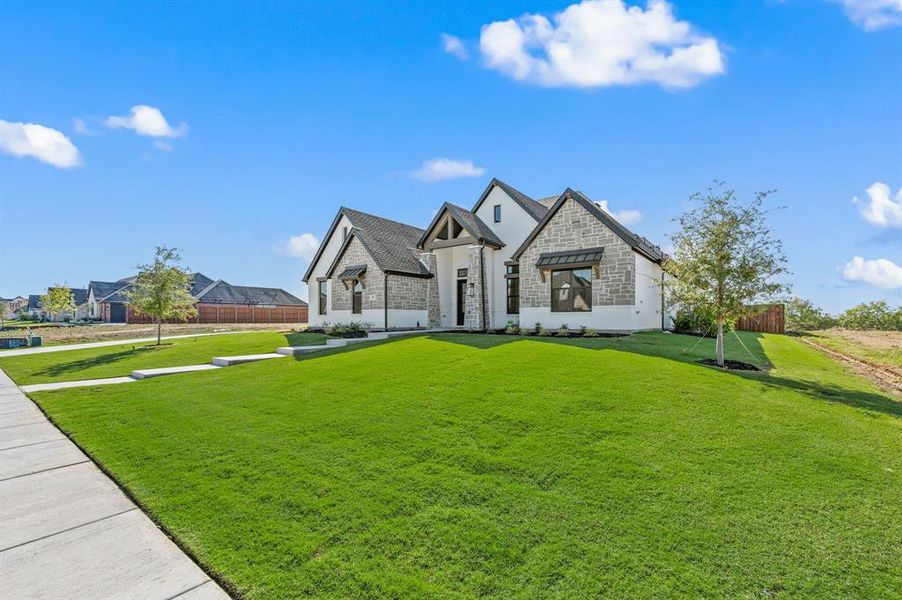 Front exterior of a new home in NorthGlen, Haslet, TX, highlighting curb appeal (Image 1). Front exterior of a new home in NorthGlen, Haslet, TX, highlighting curb appeal (Image 1).