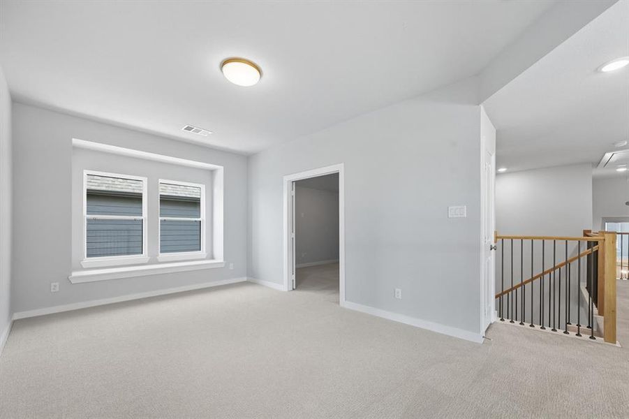 Spare room featuring carpet and recessed lighting