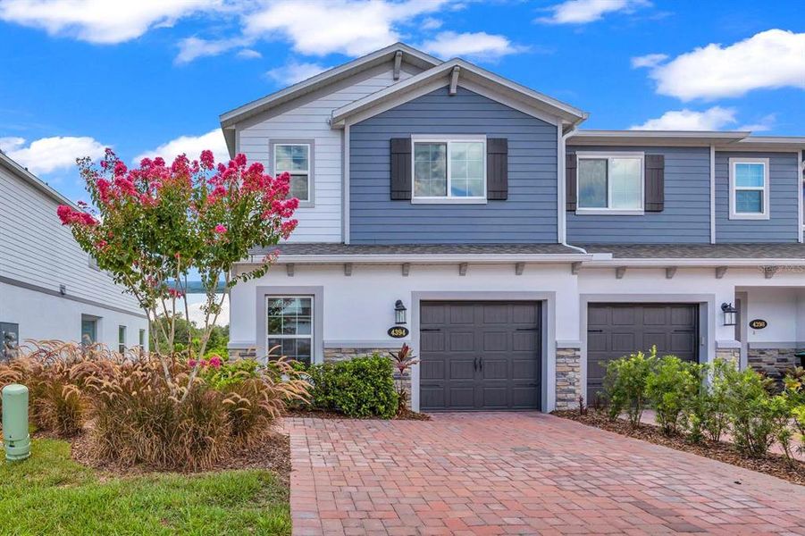 Front exterior of a new home in , Orlando, FL, highlighting curb appeal (Image 2).