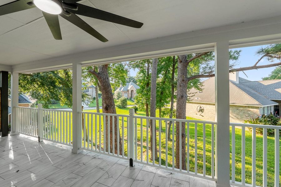 Experience serene backyard views from your inviting back porch. Experience serene backyard views from your inviting back porch.