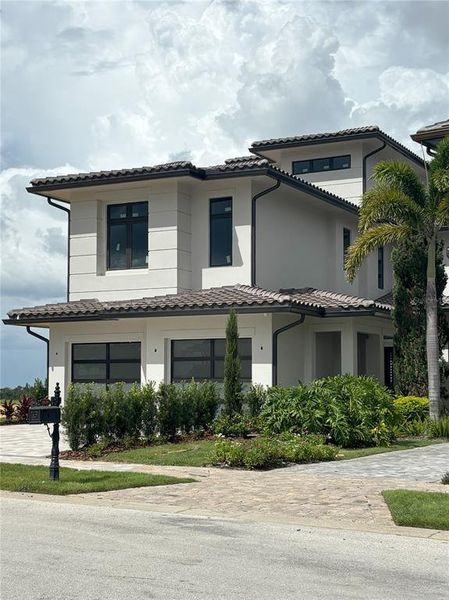 Front exterior of a new home in , Montverde, FL, highlighting curb appeal (Image 25).
