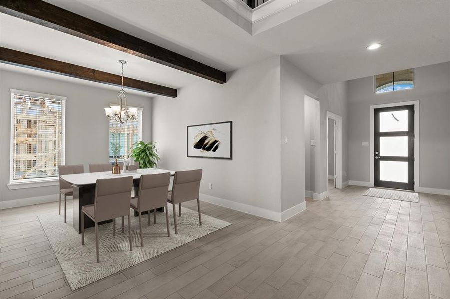 Make memories gathered around the table with your family and friends! This dining room features high ceilings with wood beam accents, custom paint, large windows with privacy blinds and chandelier.