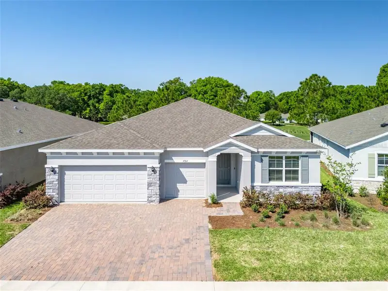 Front exterior of a new home in , Ocala, FL, highlighting curb appeal (Image 1). Front exterior of a new home in , Ocala, FL, highlighting curb appeal (Image 1).