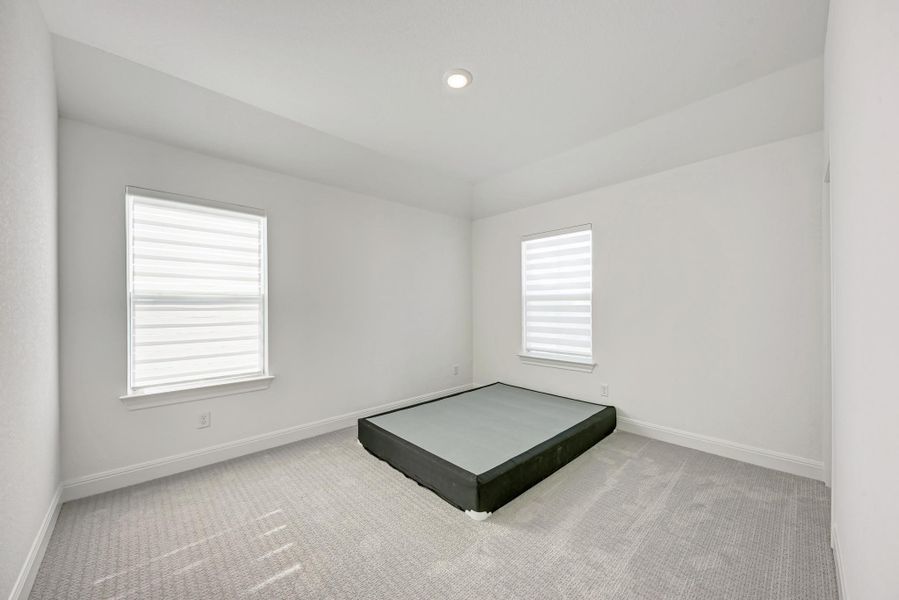 Spare room featuring light carpet and recessed lighting