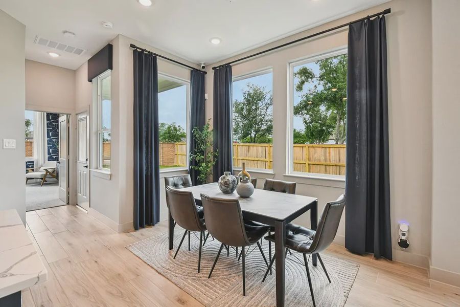 Furnished interior view inside a new home in Meridiana Chateau, Manvel (Image 37).
