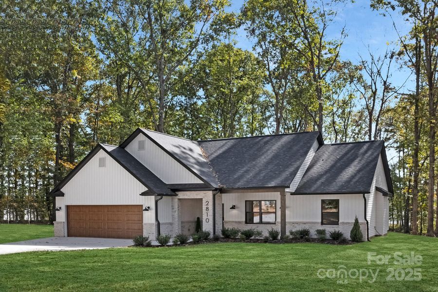 Front exterior of a new home in , Gastonia, NC, highlighting curb appeal (Image 23).