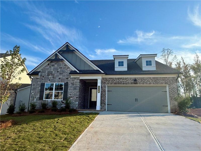 Front exterior of a new home in Ponderosa Farms Estates, Gainesville, GA, highlighting curb appeal (Image 1).