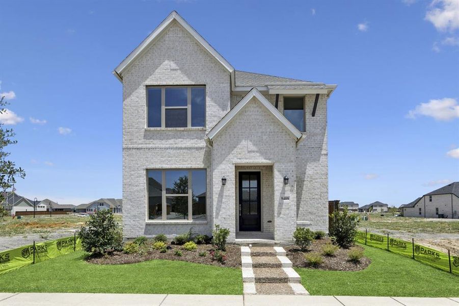 Front exterior of a new home in Talia – Cottage Series, Mesquite, TX, highlighting curb appeal (Image 1).