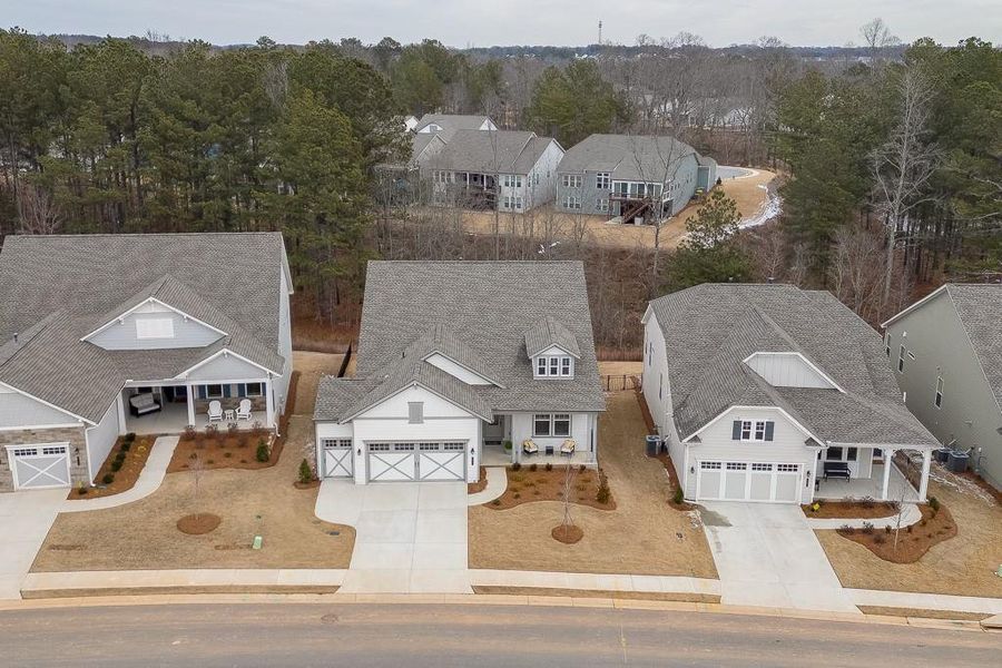 Front exterior of a new home in , Hoschton, GA, highlighting curb appeal (Image 18).