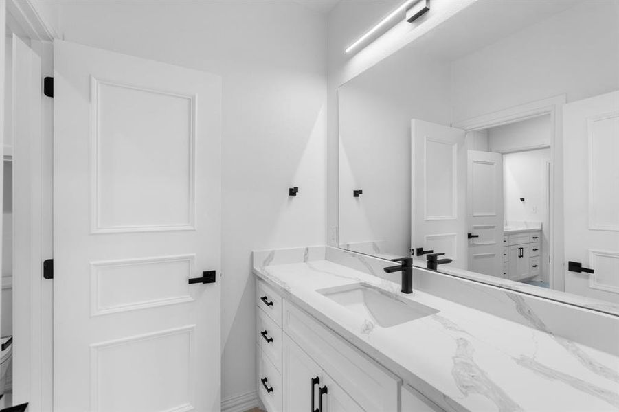 Bathroom featuring vanity and toilet Bathroom featuring vanity and toilet