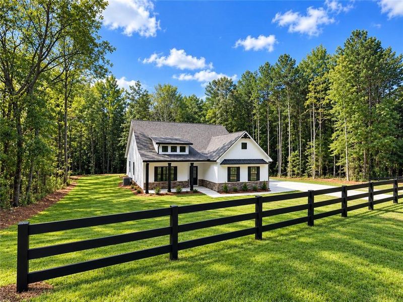 Front exterior of a new home in , Silver Creek, GA, highlighting curb appeal (Image 2). Front exterior of a new home in , Silver Creek, GA, highlighting curb appeal (Image 2).
