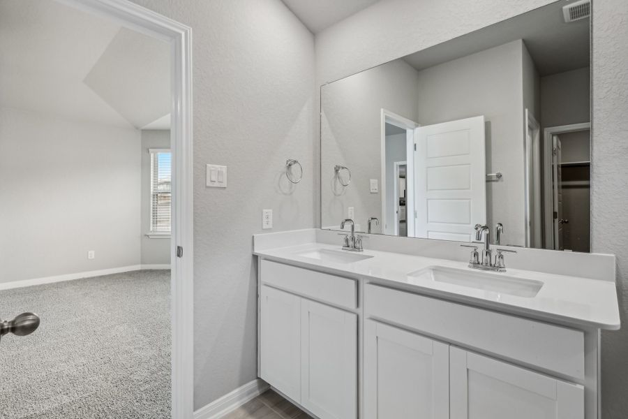 Primary suite bathroom in the Allen floorplan at a Meritage Homes community. Primary suite bathroom in the Allen floorplan at a Meritage Homes community.