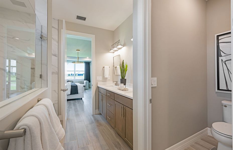 Representative furnished interior of a home built from the Easley by DiVosta in Emerson Oaks, Vero Beach (Image 12).