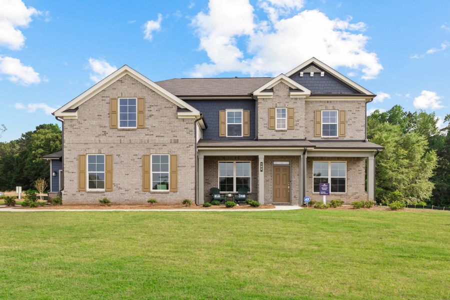Front exterior of a new home in Oakhurst Manor, McDonough, GA, highlighting curb appeal (Image 1). Front exterior of a new home in Oakhurst Manor, McDonough, GA, highlighting curb appeal (Image 1).
