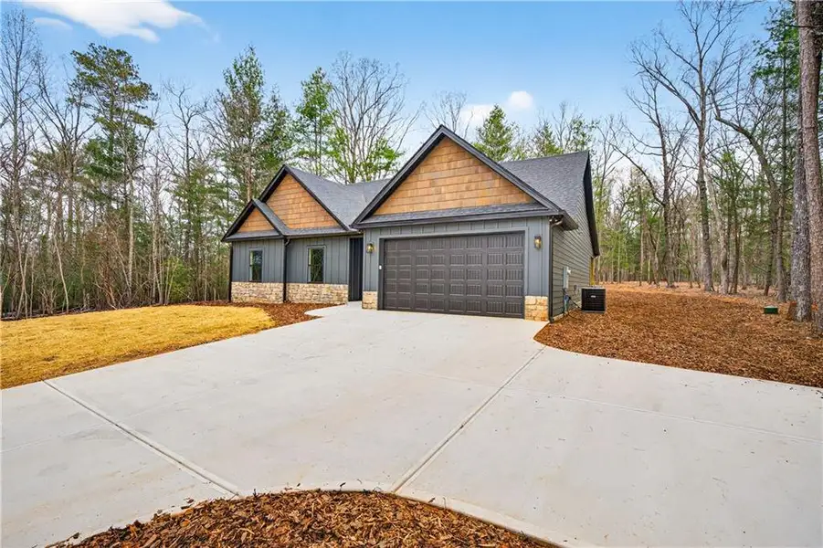 Front exterior of a new home in , Ellijay, GA, highlighting curb appeal (Image 23).
