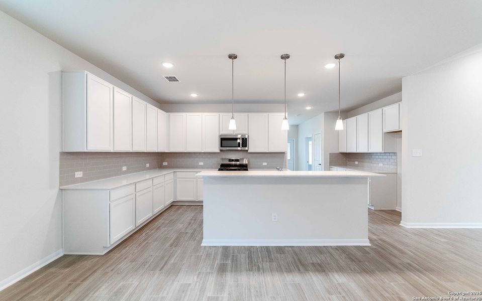 Furnished interior view inside a new home in Hickory Ridge, Elmendorf (Image 2). Furnished interior view inside a new home in Hickory Ridge, Elmendorf (Image 2).