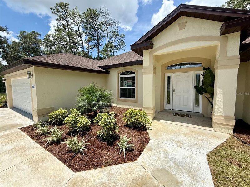 Front exterior of a new home in , Dunnellon, FL, highlighting curb appeal (Image 21).