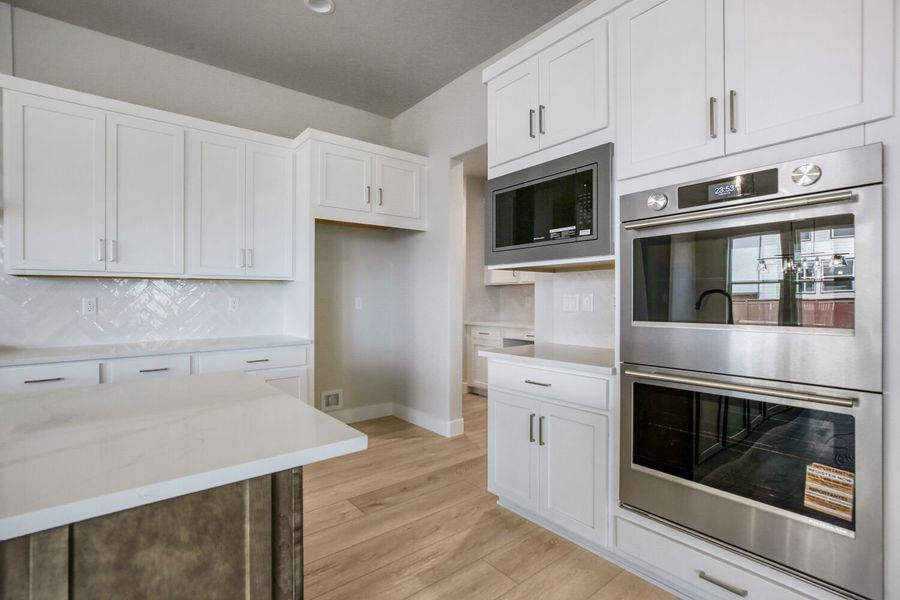 Furnished interior view inside a new home in RainDance, Windsor (Image 9).